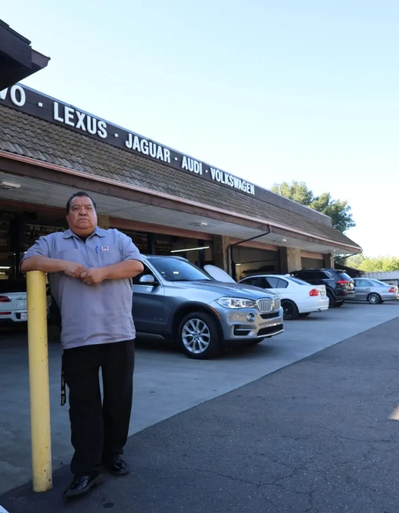 A man standing in front of our shop